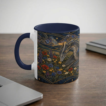 A white ceramic mug with dark blue handle and rim rests on a wooden desk.