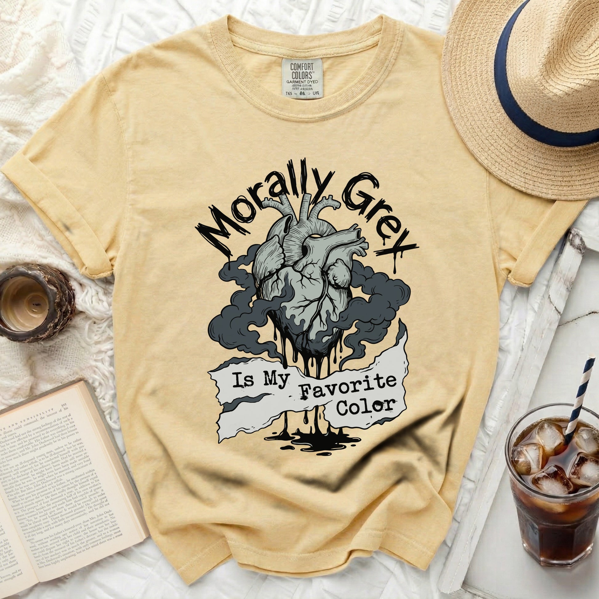 Yellow t-shirt with a gray heart graphic and the text "Morally Grey Is My Favorite Color."