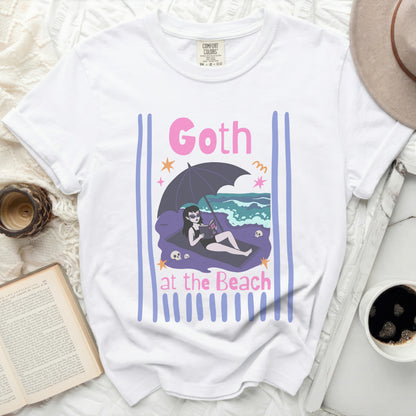 White t-shirt with "Goth at the Beach" design featuring a vampire reading.