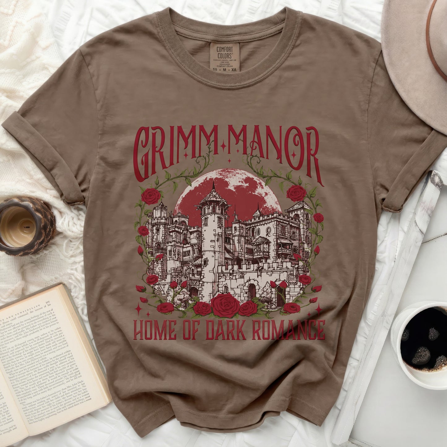 T-shirt with Grimm Manor and roses graphic and "Home of Dark Romance" text.