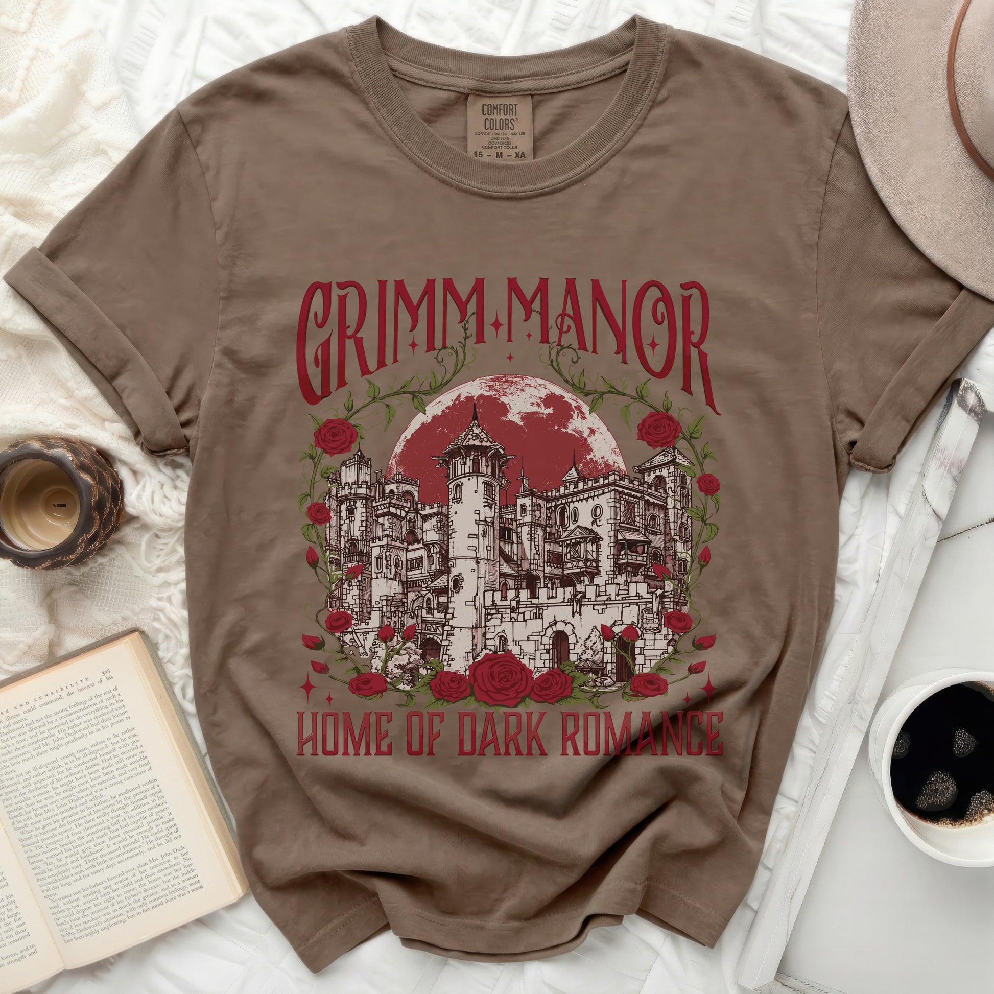 T-shirt with Grimm Manor and roses graphic and "Home of Dark Romance" text.