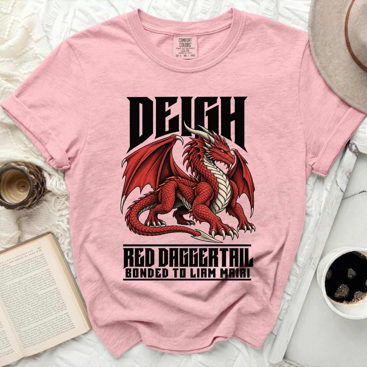 Pink t-shirt with a red dragon graphic and text: DEIGH, RED DAGGERTAIL, BONDED TO LIAM MAIRI.
