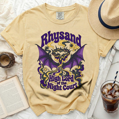 Yellow t-shirt with "Rhysand High Lord of the Night Court" graphic.