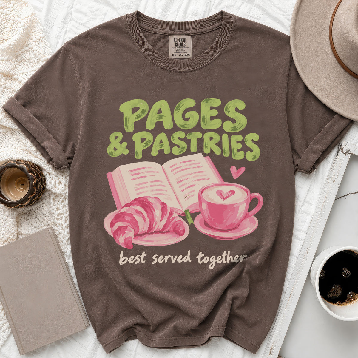 Brown t-shirt with "PAGES & PASTRIES best served together" text and illustration.