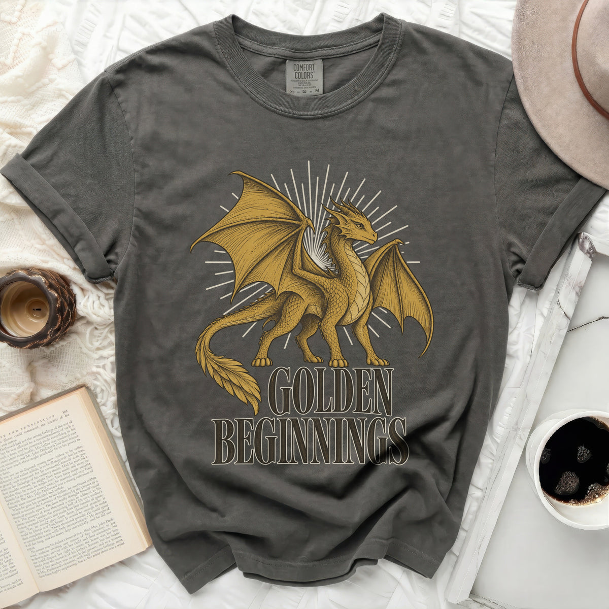 Dark grey t-shirt with a gold dragon graphic and text "GOLDEN BEGINNINGS."