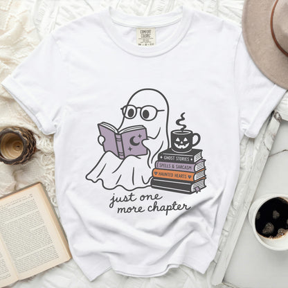 White t-shirt with ghost reading book and "just one more chapter" text.