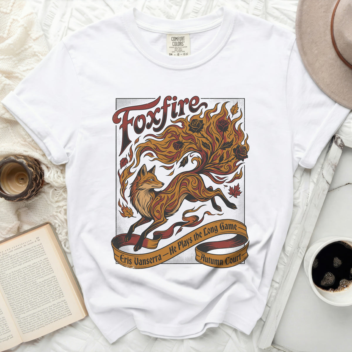 White t-shirt with "Foxfire" and a fox design, "Eris Vanserra - He Plays the Long Game - Autumn Court".