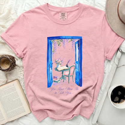 Pink t-shirt with watercolor print of an open blue door with wisteria and "You Must Allow Me to Tell You..."