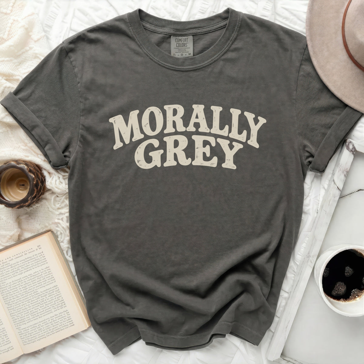 Comfort Colors t-shirt with distressed "MORALLY GREY" text and a cream hat.