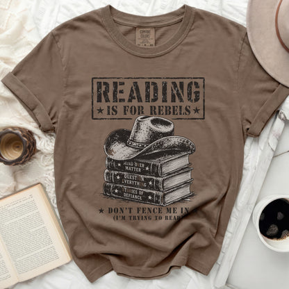 Brown t-shirt with "Reading is for rebels" text and cowboy hat graphic.