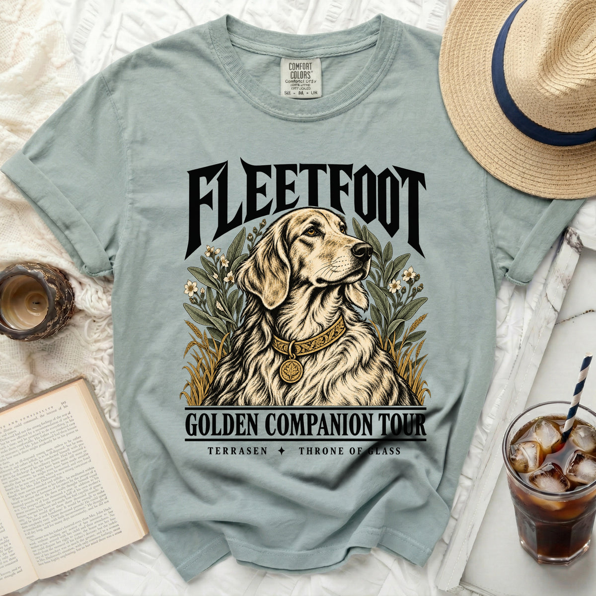 Light blue t-shirt with "FLEETFOOT GOLDEN COMPANION TOUR TERRASEN THRONE OF GLASS" and dog graphic.