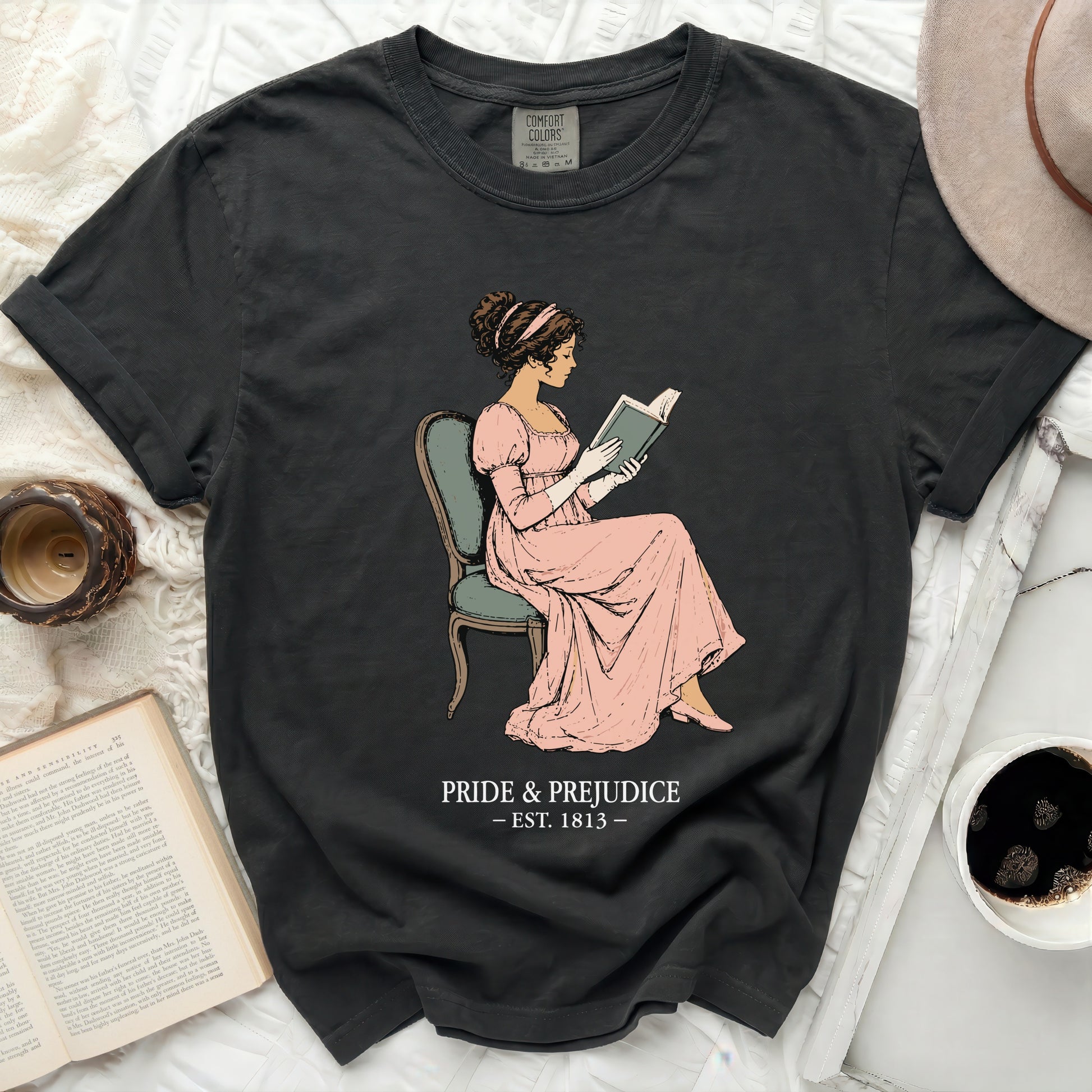 Dark gray t-shirt with "Pride & Prejudice Est. 1813" and illustration.