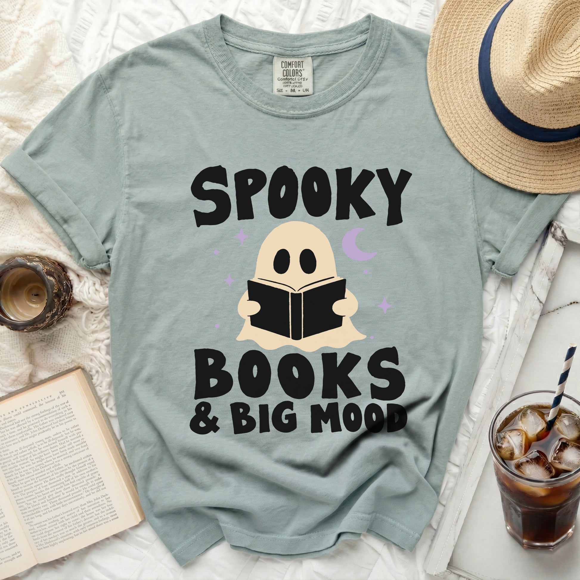 Light green t-shirt with "Spooky Books & Big Mood" text and ghost graphic.