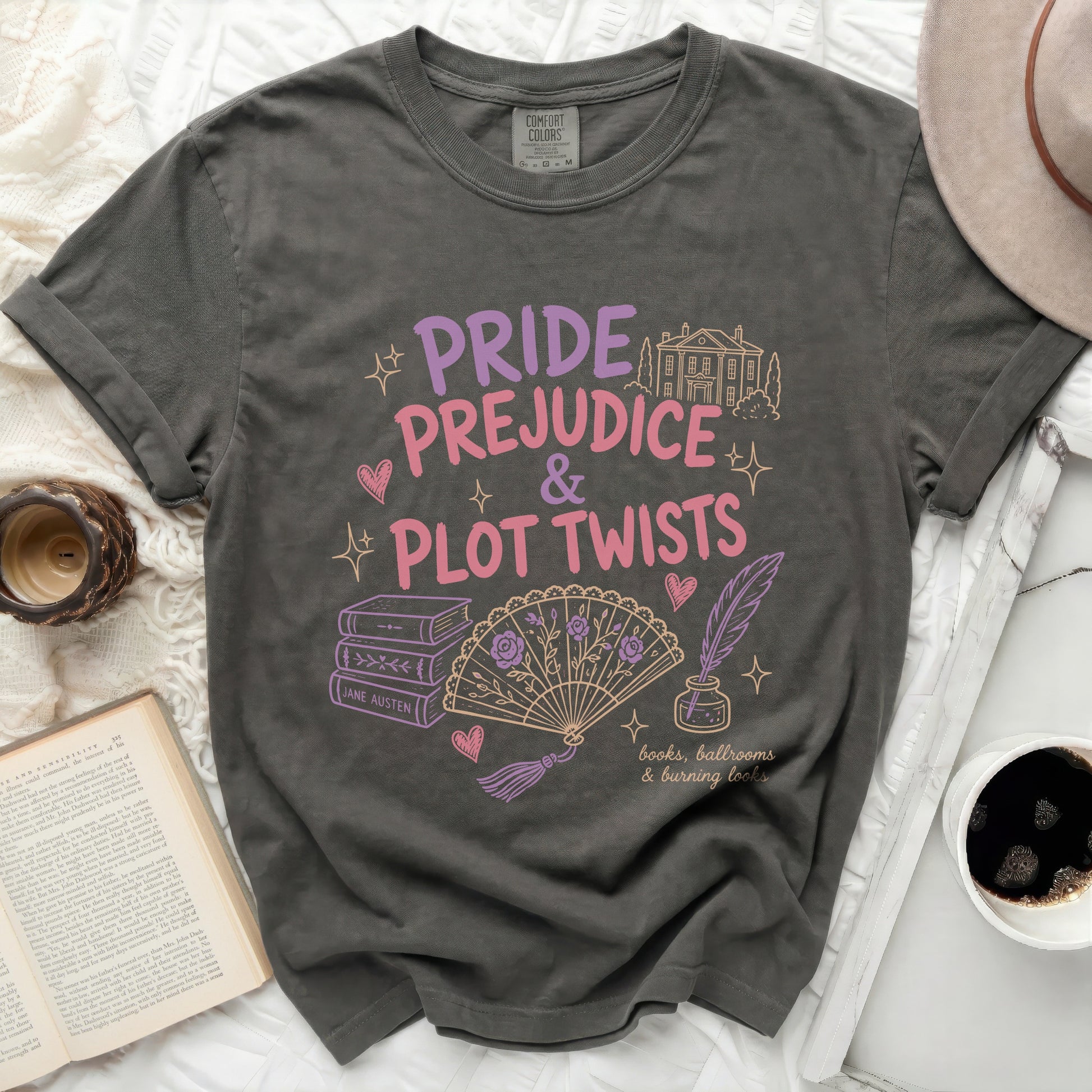Grey t-shirt with "Pride & Prejudice & Plot Twists" and Jane Austen book illustrations.