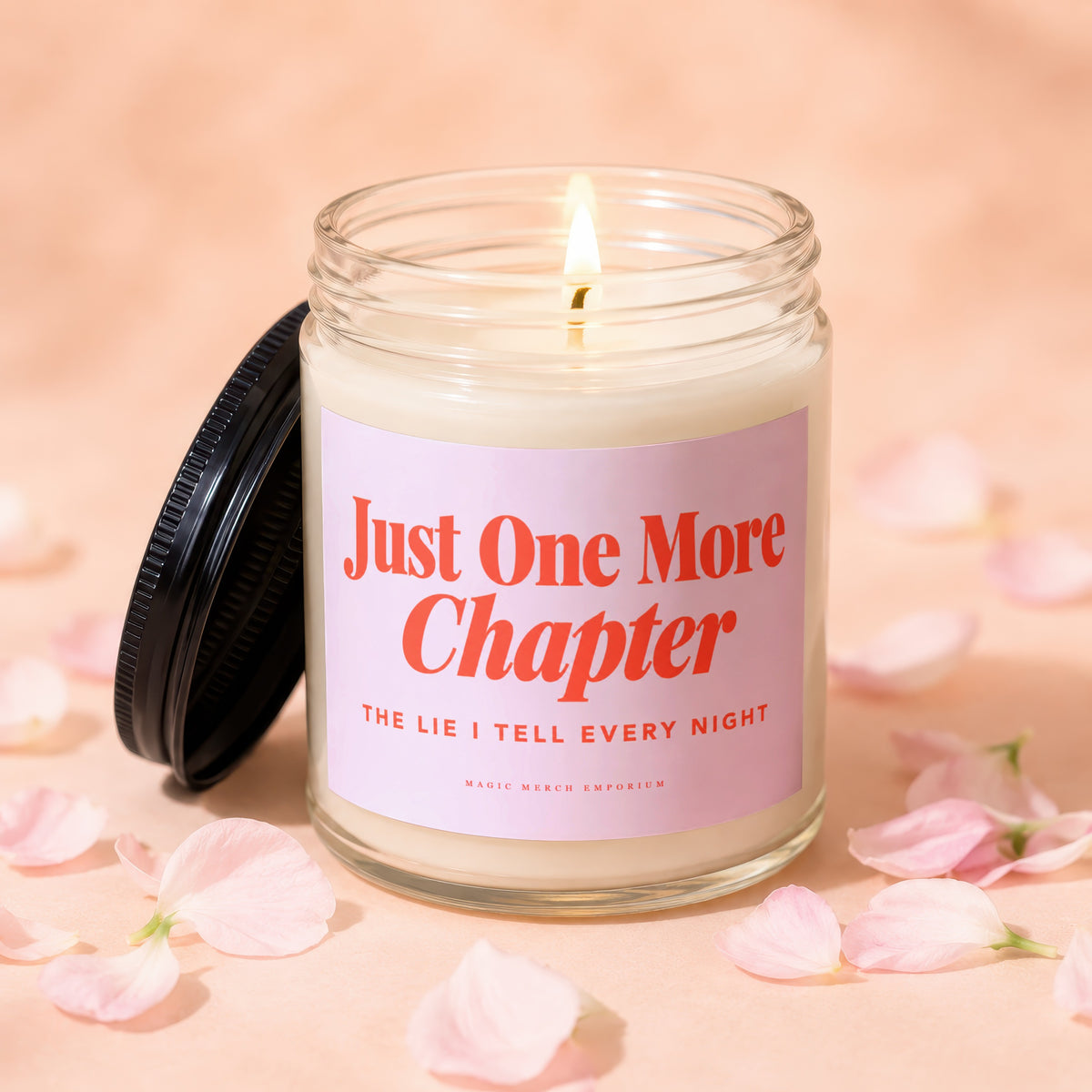 Glass candle with pink label reading "Just One More Chapter" and "The Lie I Tell Every Night".