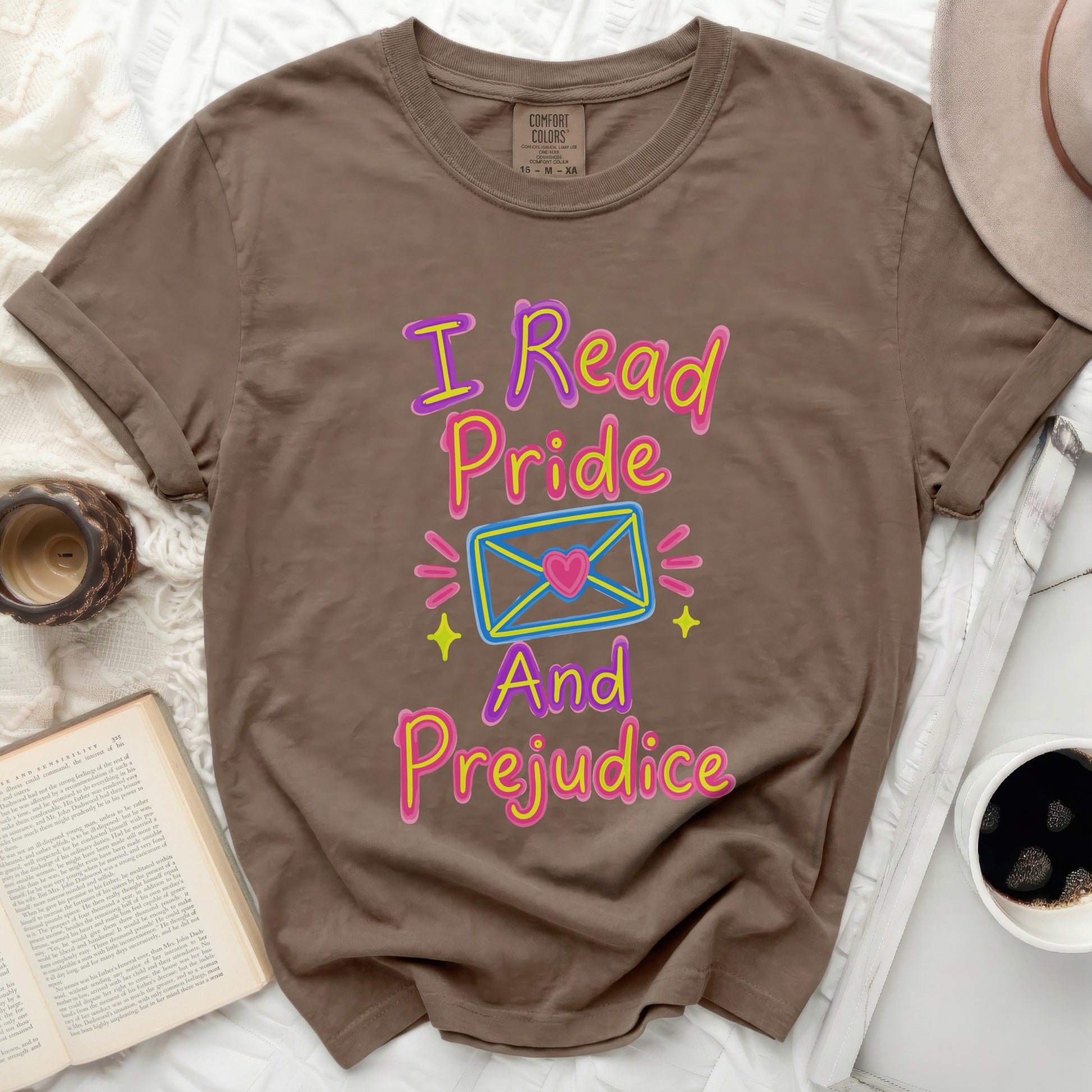 Brown t-shirt with "I Read Pride And Prejudice" text design.
