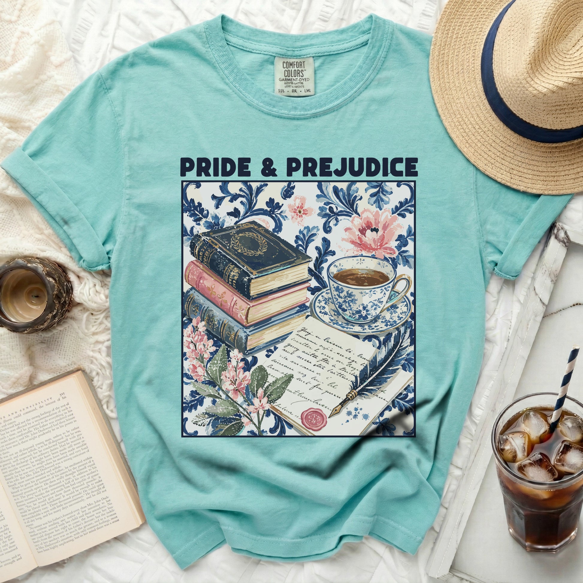 Turquoise t-shirt with "Pride & Prejudice" text and vintage book illustration.