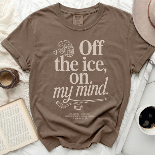 Brown t-shirt with "Off the ice, on my mind." and hockey graphic.