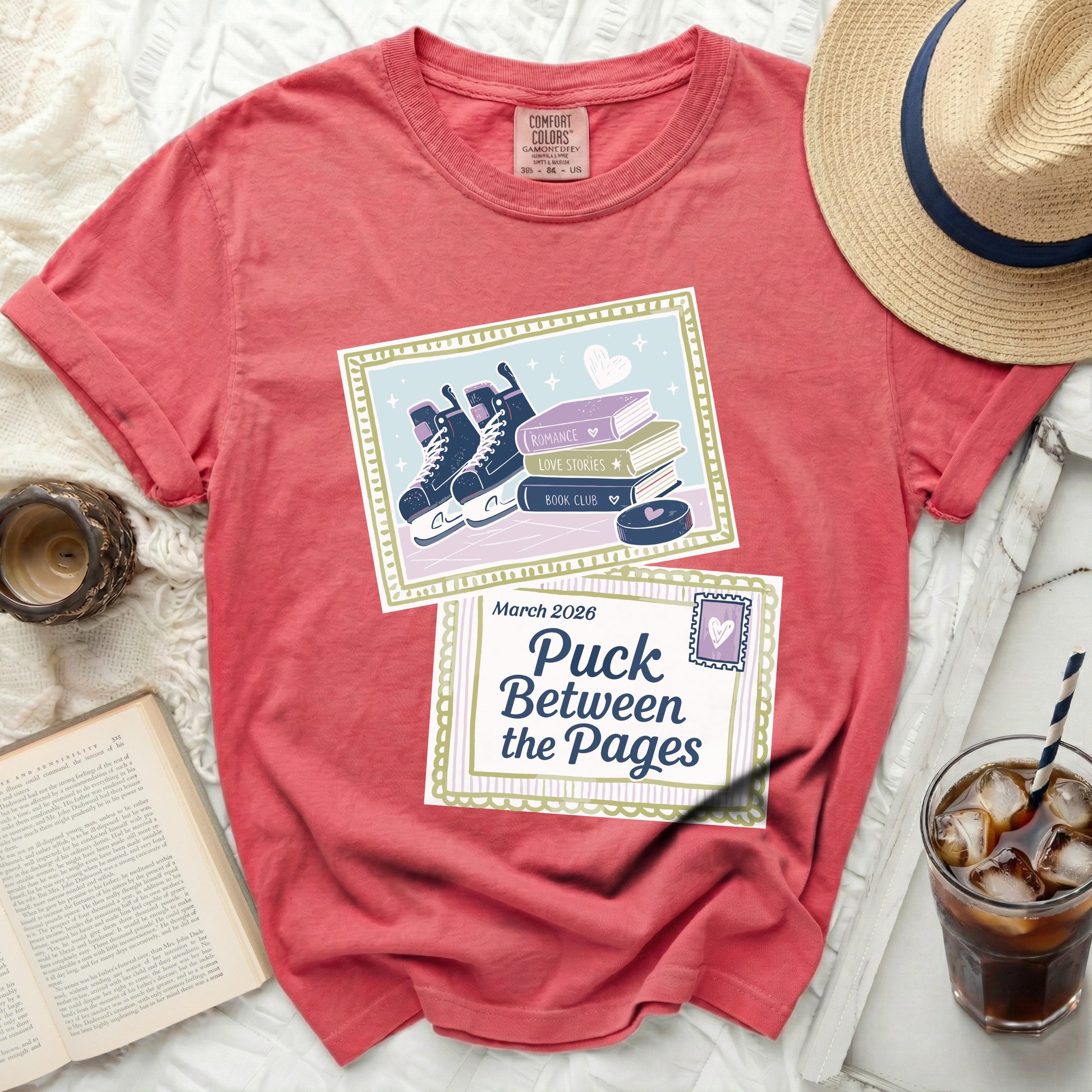 Red t-shirt with "Puck Between the Pages" graphic, roller skates, and books.