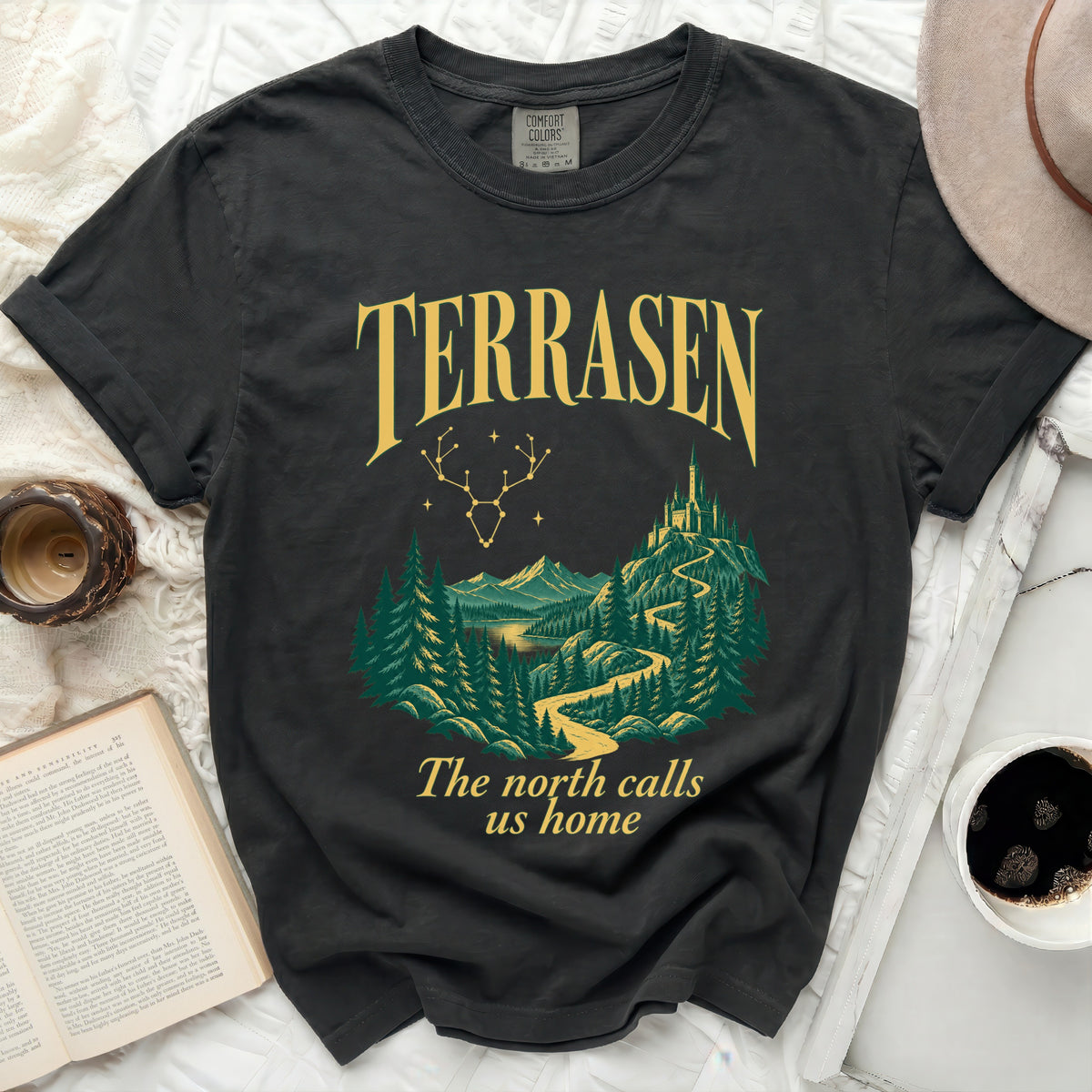 Dark t-shirt with a forest, castle, and text "Terrasen The north calls us home".