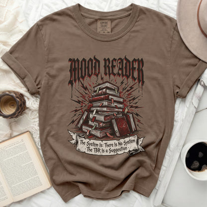 Brown t-shirt with "MOOD READER" and stack of books graphic.