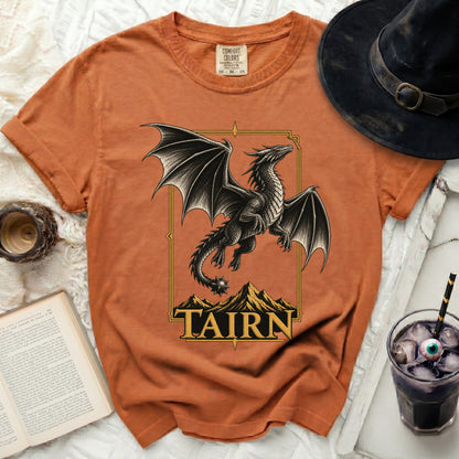 Orange t-shirt with a detailed dragon design and "TAIRN" text.