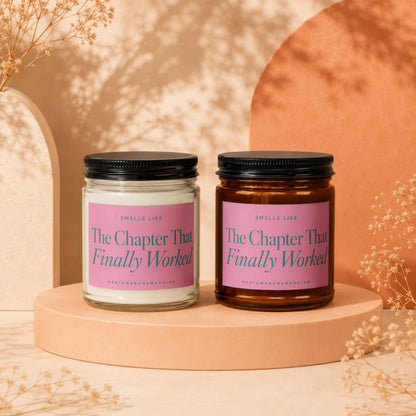 Two candles displayed, one clear and one amber, with pink labels.