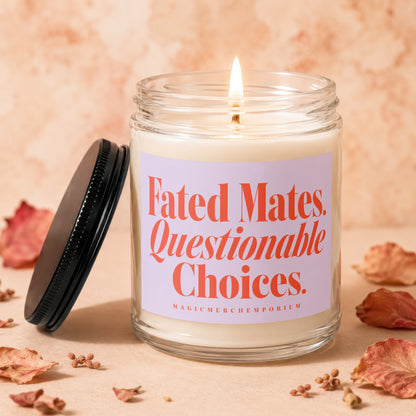 Glass jar candle with lit wick and lavender label reading "Fated Mates. Questionable Choices."