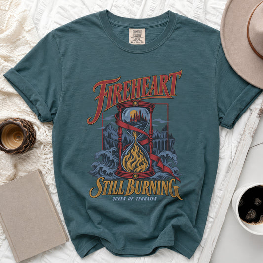 Teal t-shirt with "Fireheart Still Burning Queen of Terrasen" text and hourglass graphic.