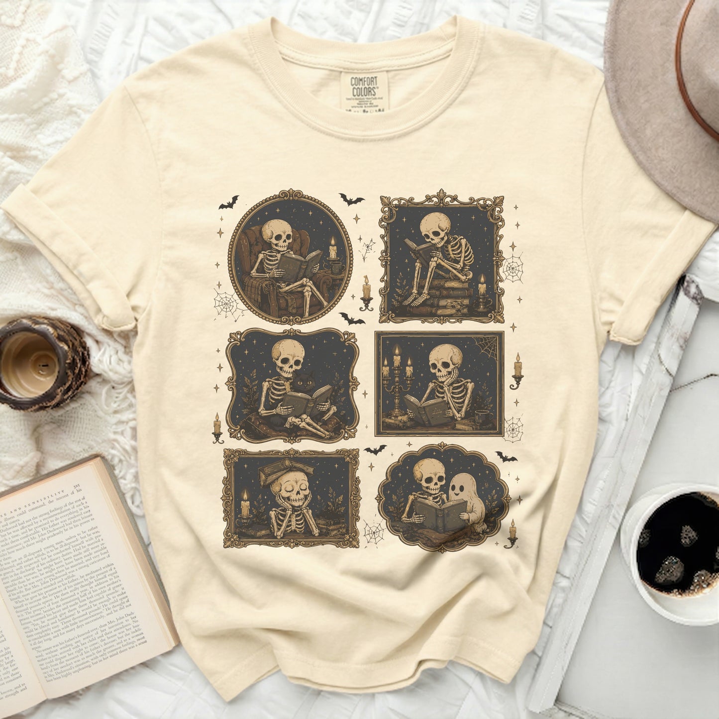 T-shirt with six framed illustrations of skeletons reading and holding books.