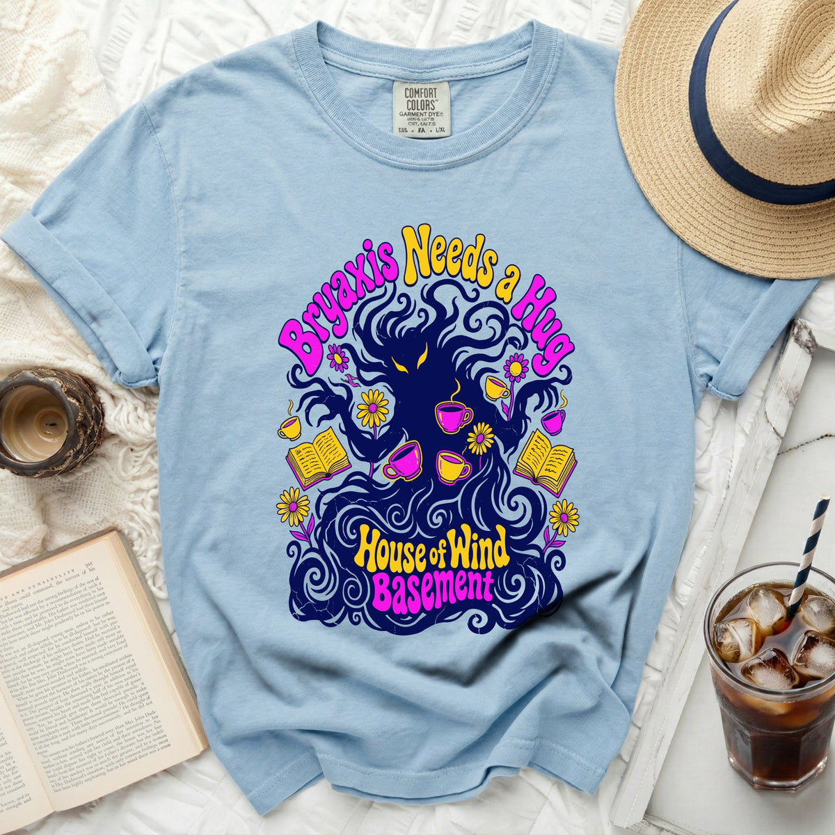 Light blue Comfort Colors t-shirt with a graphic of dark wavy hair and text.
