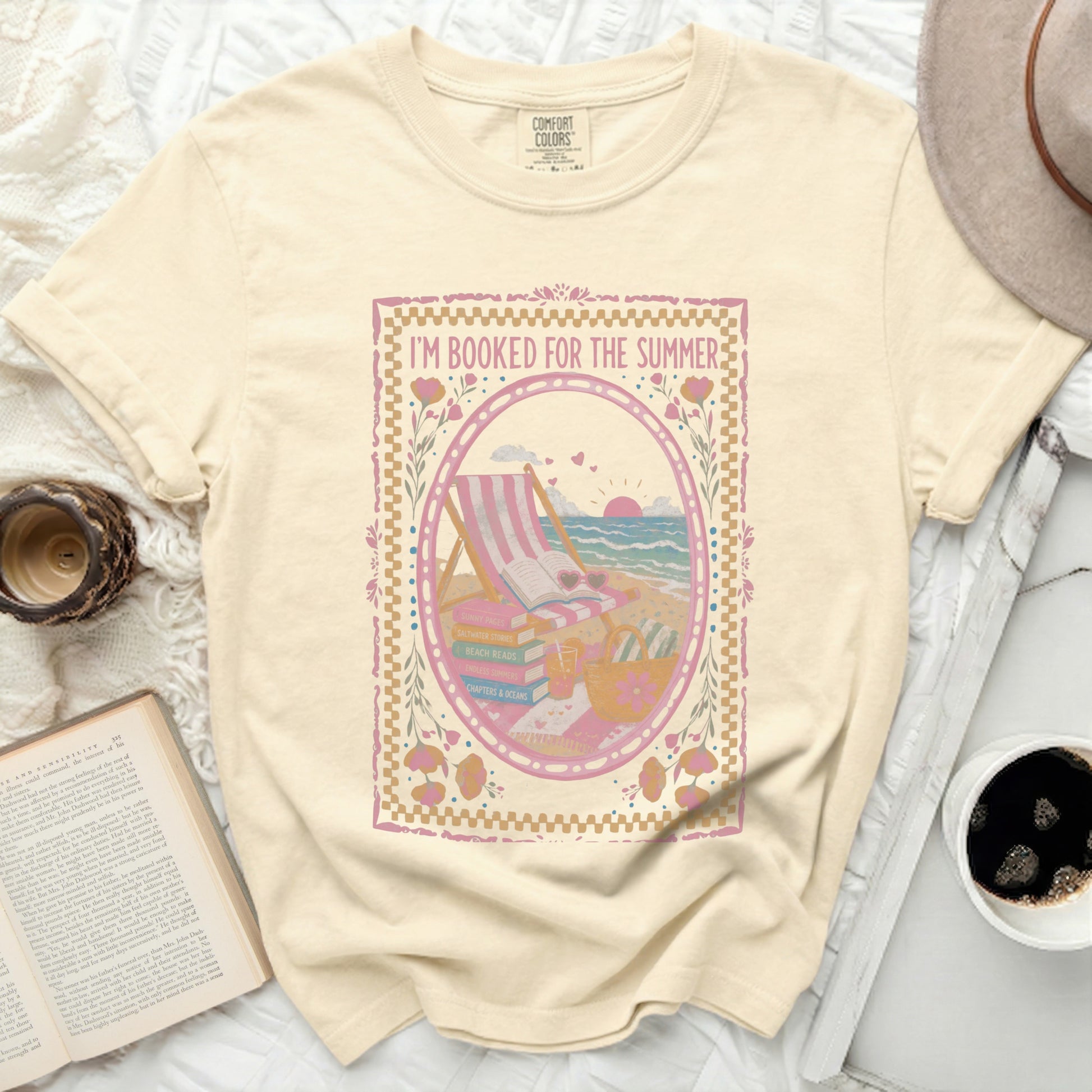 Yellow t-shirt with "I'm Booked for the Summer" and beach reading graphics.