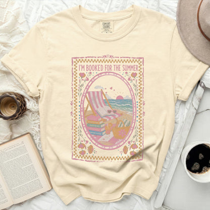 Yellow t-shirt with "I'm Booked for the Summer" and beach reading graphics.