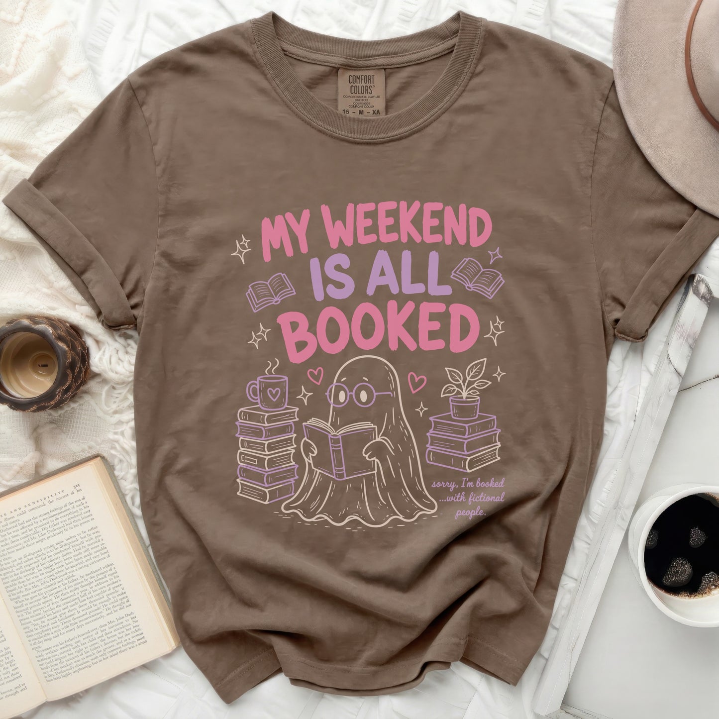 Brown t-shirt with ghost reading featuring text "MY WEEKEND IS ALL BOOKED".