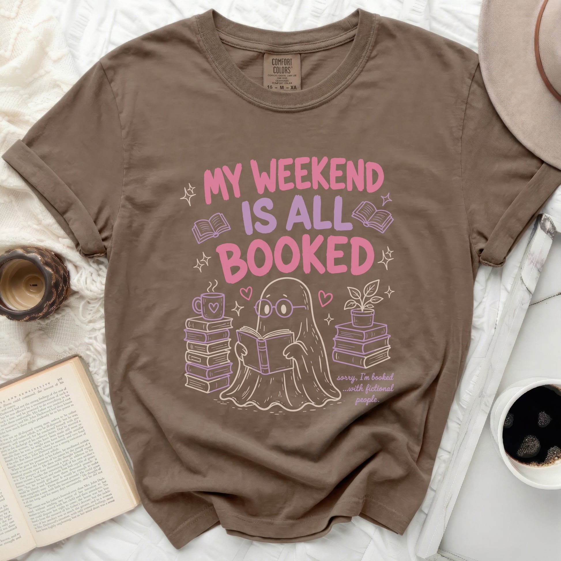Brown t-shirt with ghost reading featuring text "MY WEEKEND IS ALL BOOKED".