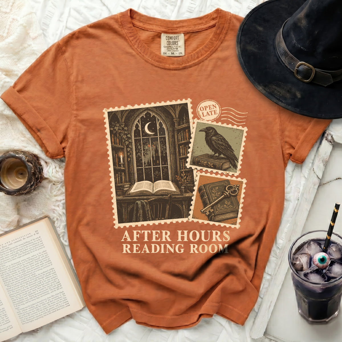 Orange t-shirt with "After Hours Reading Room" graphic of postage stamps.