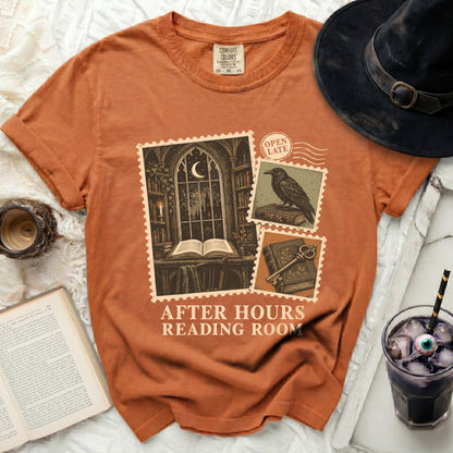 Orange t-shirt with "After Hours Reading Room" graphic of postage stamps.