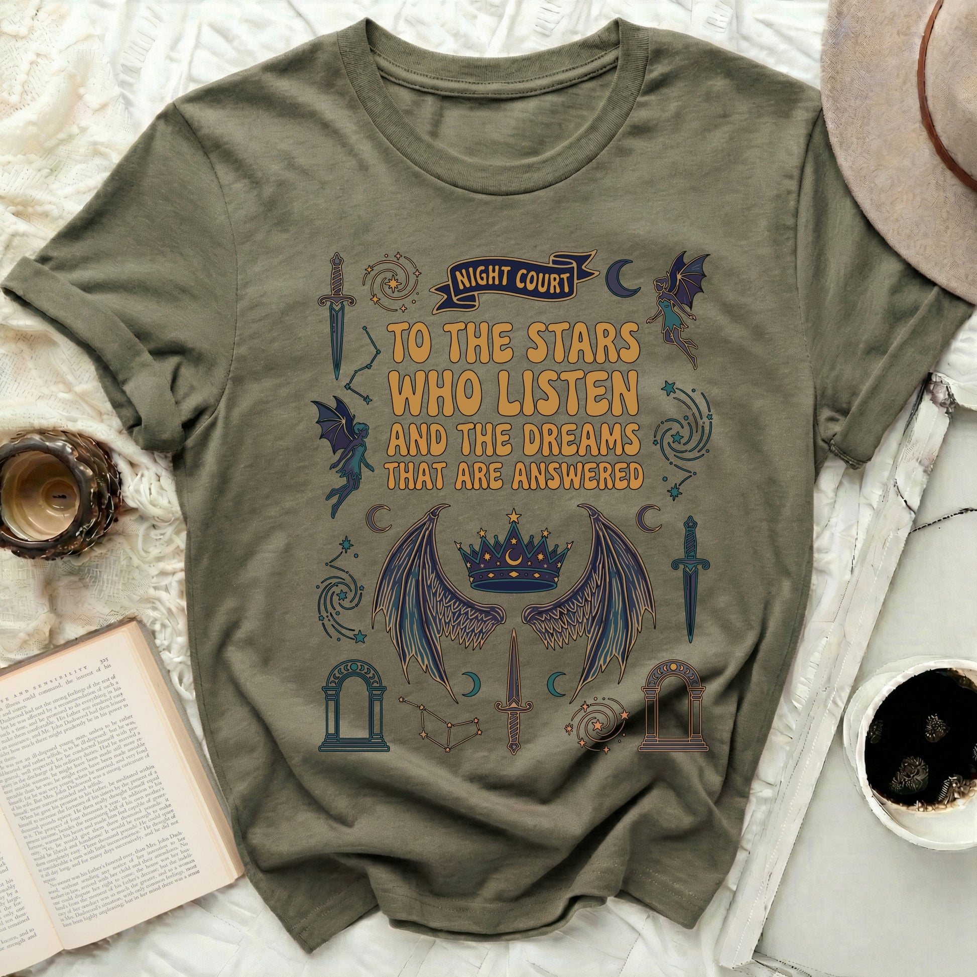 Night Court Stars Listen Dreams Answered Magical Graphic product type
Night Court, Fantasy Shirt, Book Lover Gift, Stars Listen Quote, Dreams Answered, Magical Design, Crown Wings Art, Fairy Graphic, Celestial Print, Moon Phases, Dagger Sword, Archway Symbol, Fae Realm, Aesthetic Tee, Mythical Fashion, Literary Merch, Graphic Tee, Unisex T-shirt, Whimsical Wear, Enchanted Theme