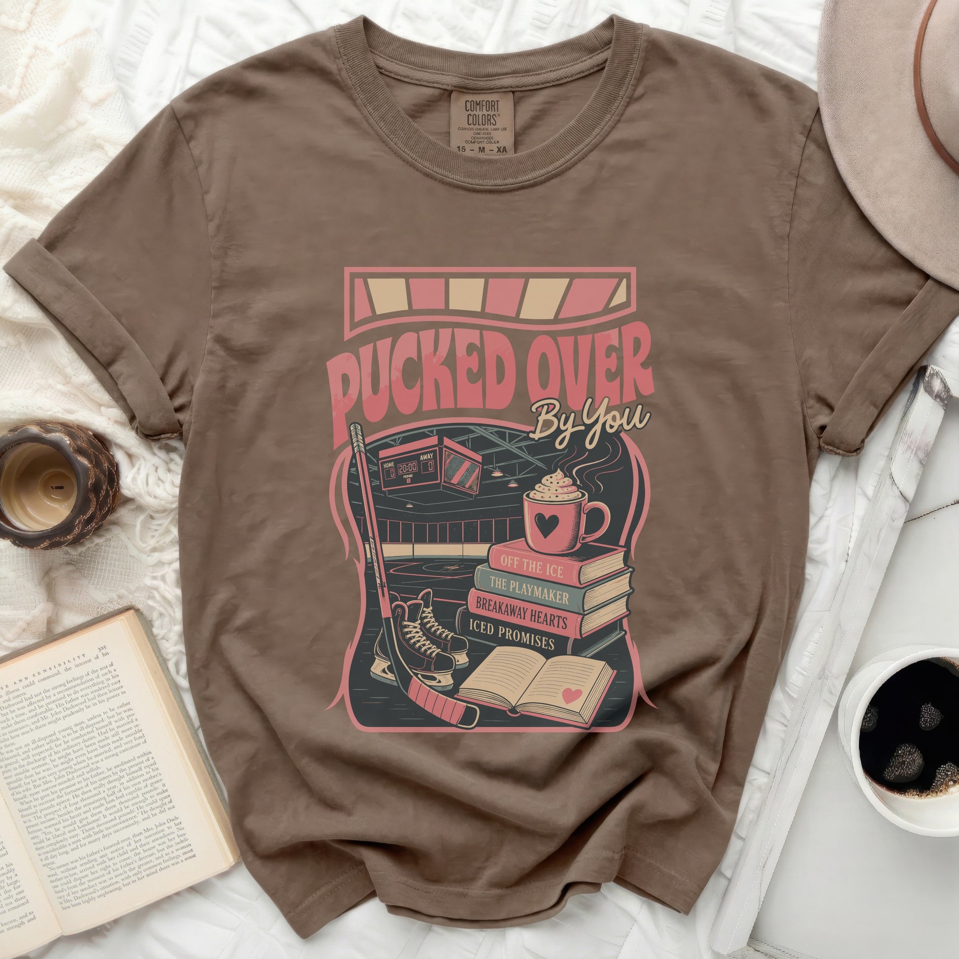 T-shirt with "Pucked Over By You" and hockey imagery.