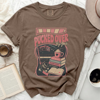 T-shirt with "Pucked Over By You" and hockey imagery.