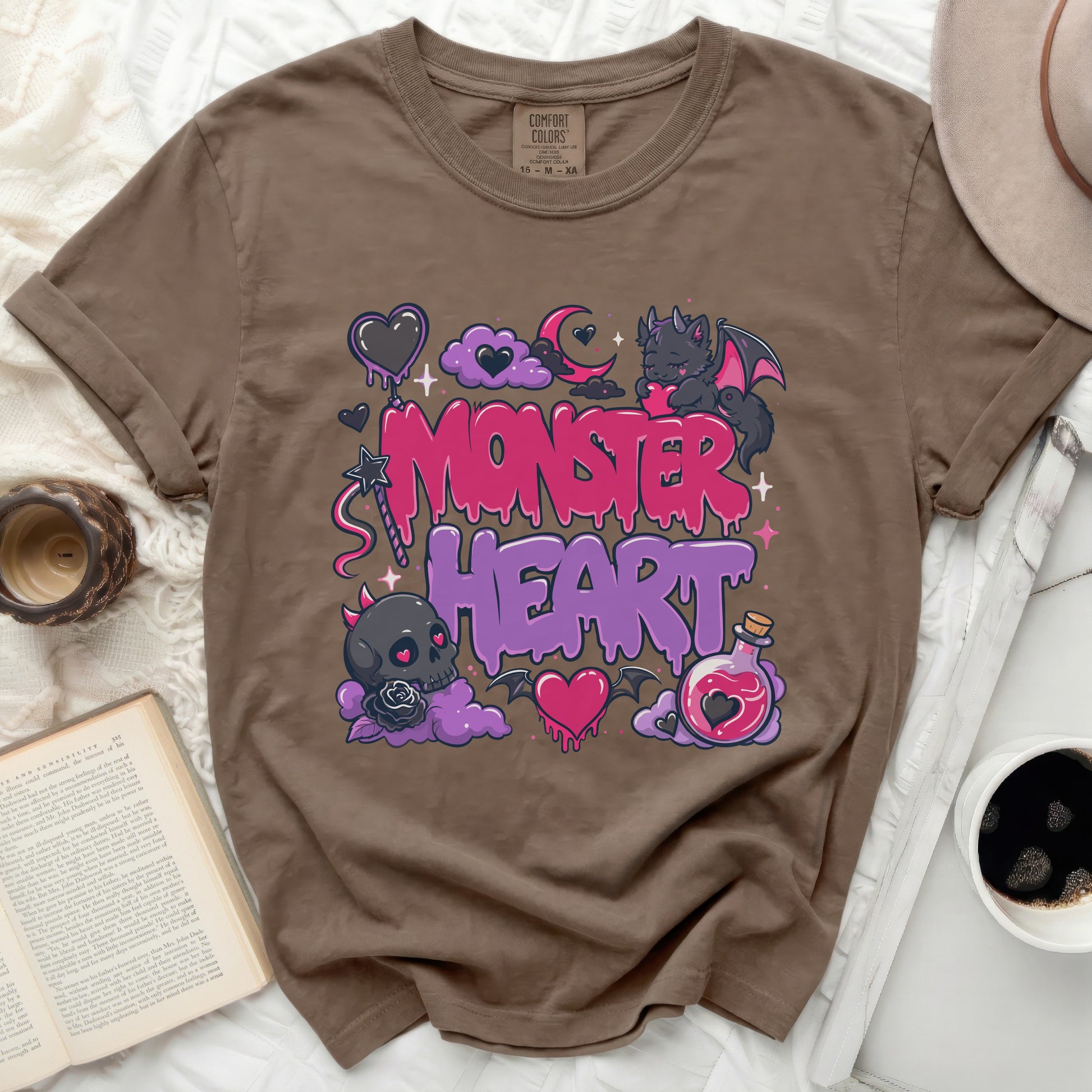 Brown t-shirt with "Monster Heart" graphic, clouds, and a bat.