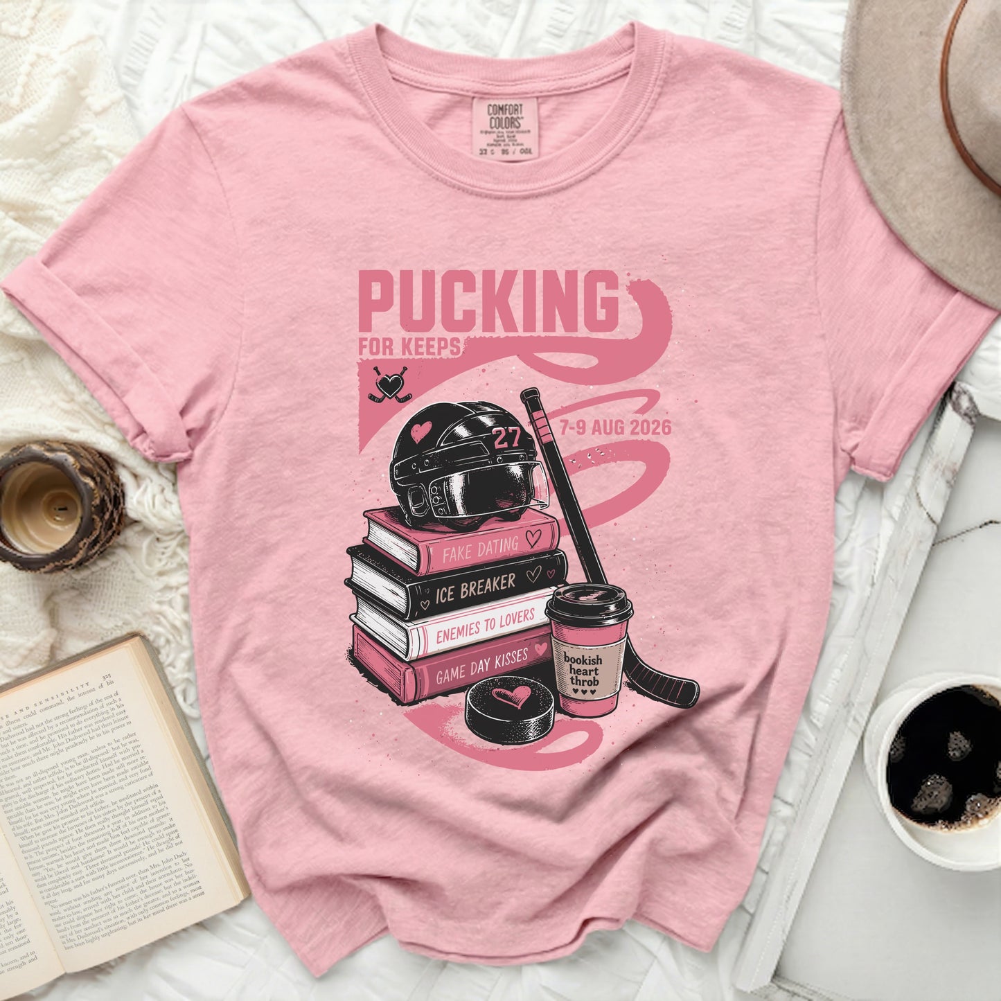 Pink t-shirt with "Pucking for Keeps" text and hockey graphics.