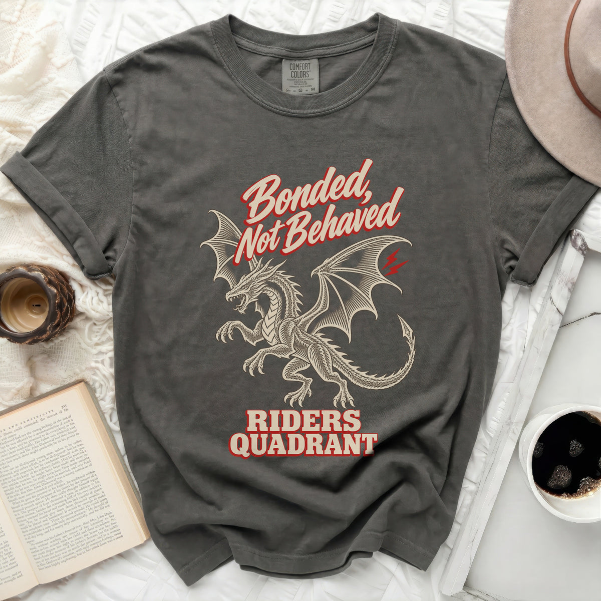 Dark grey t-shirt with a dragon graphic and text "Bonded, Not Behaved Riders Quadrant".