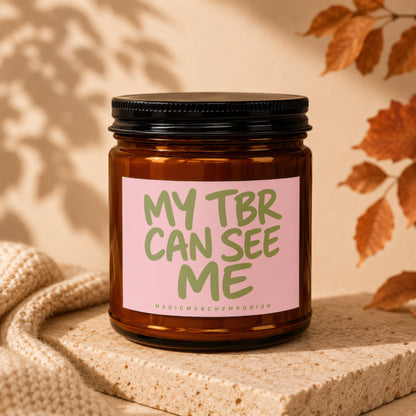 Amber jar candle with pink label reading "MY TBR CAN SEE ME".