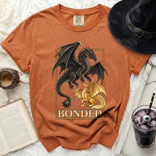 Orange t-shirt with a black and gold dragon design and the word "BONDED".