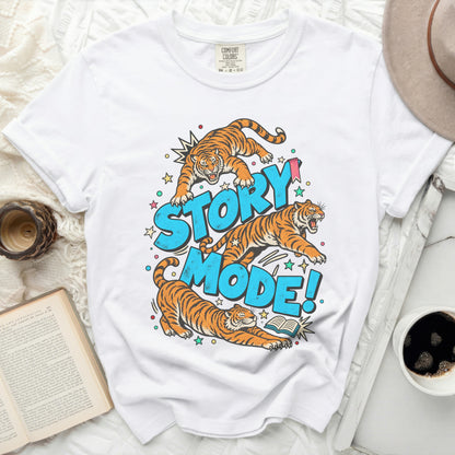 White t-shirt with tigers jumping and the text "STORY MODE!"