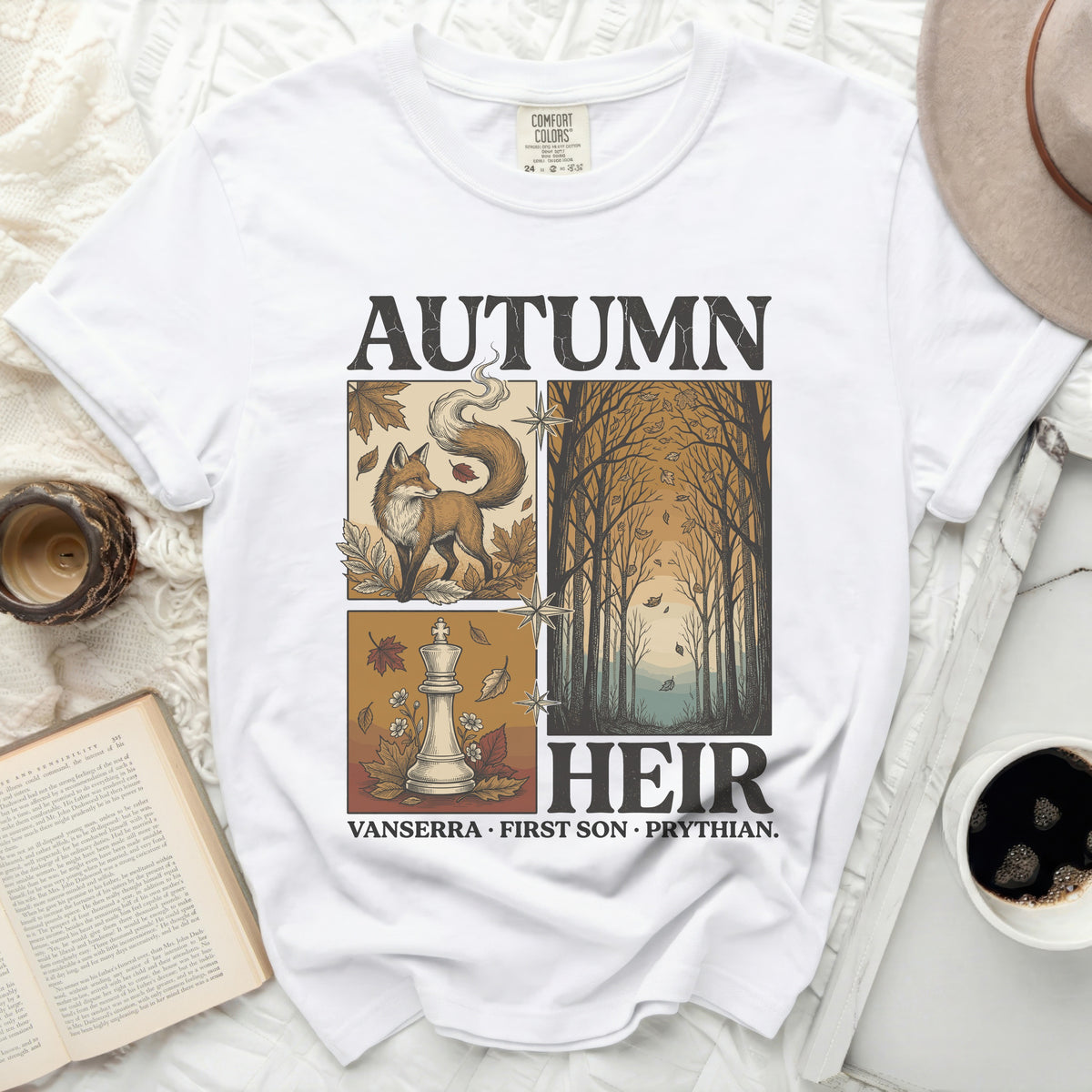 White t-shirt with "Autumn Heir" graphic featuring a fox, chess piece, and trees.