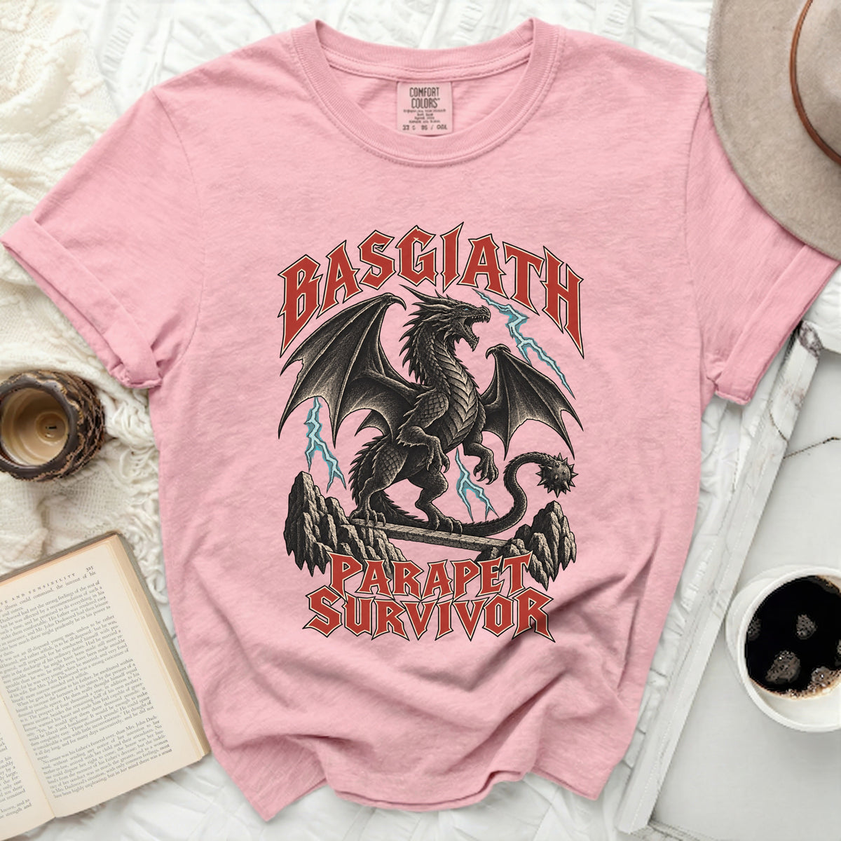 Pink t-shirt with black dragon and text "BASGIATH PARAPET SURVIVOR".
