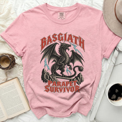 Pink t-shirt with black dragon and text "BASGIATH PARAPET SURVIVOR".