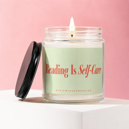 Lit candle in glass jar with "Reading Is Self-Care" label and black lid.